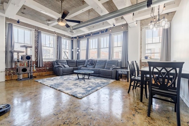 living area with finished concrete flooring and ceiling fan