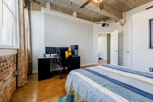 bedroom featuring concrete floors, baseboards, and a ceiling fan