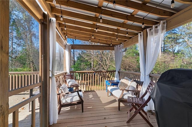 wooden terrace featuring area for grilling