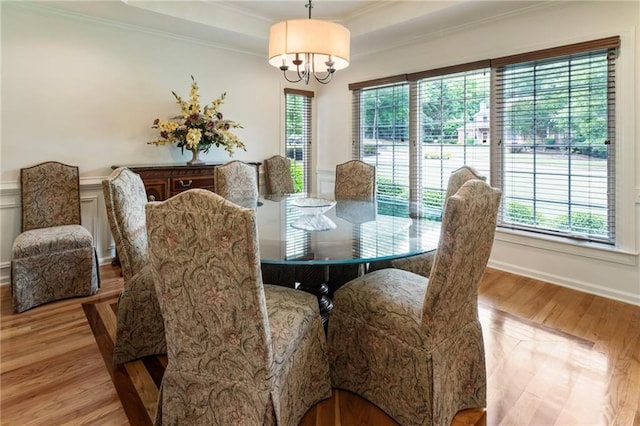 135 Stone Orchard Ct, Milton, GA 30004 - dining room with healthy amount of natural light, ornamental molding, wood finished floors, a chandelier, and baseboards