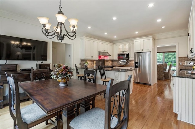 135 Stone Orchard Ct, Milton, GA 30004 - dining area with a chandelier, crown molding, light wood finished floors, and recessed lighting