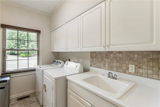135 Stone Orchard Ct, Milton, GA 30004 - clothes washing area with washing machine and clothes dryer, cabinet space, crown molding, baseboards, and light tile patterned floors