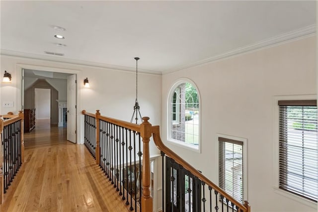 135 Stone Orchard Ct, Milton, GA 30004 - hallway featuring an upstairs landing, light wood-style floors, and crown molding