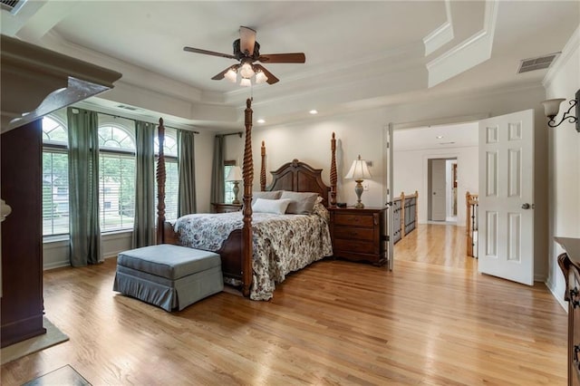 135 Stone Orchard Ct, Milton, GA 30004 - bedroom with a tray ceiling, crown molding, light wood finished floors, ceiling fan, and recessed lighting