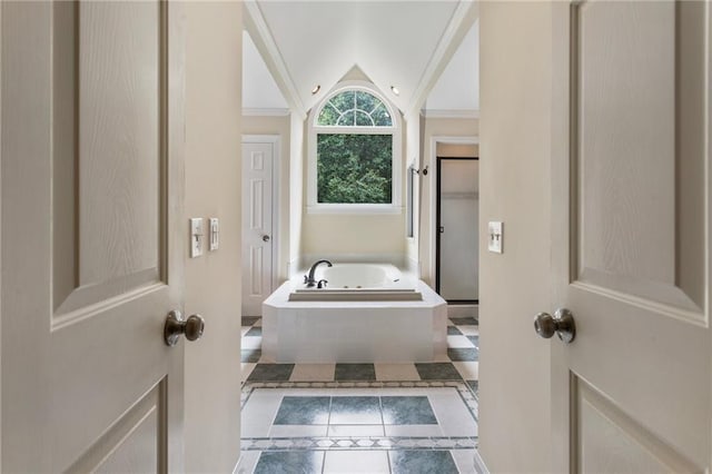 135 Stone Orchard Ct, Milton, GA 30004 - full bathroom featuring tile patterned floors, vaulted ceiling, a bath, a shower stall, and inlaid floor details
