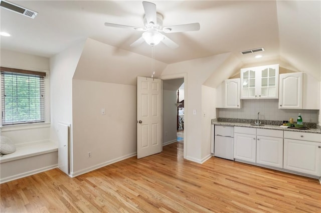 135 Stone Orchard Ct, Milton, GA 30004 - kitchen with refrigerator, light wood-type flooring, white cabinets, decorative backsplash, and ceiling fan