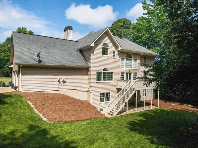 135 Stone Orchard Ct, Milton, GA 30004 - back of property featuring stairway, a yard, a wooden deck, and a chimney