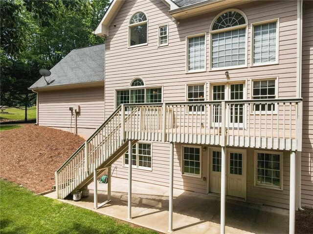 135 Stone Orchard Ct, Milton, GA 30004 - back of house featuring a patio, roof with shingles, and stairs