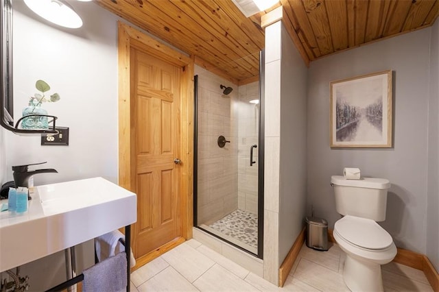 bathroom with tile patterned flooring, a shower with door, wooden ceiling, and toilet