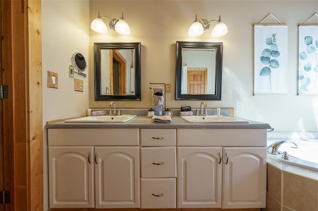 bathroom featuring vanity and a relaxing tiled tub