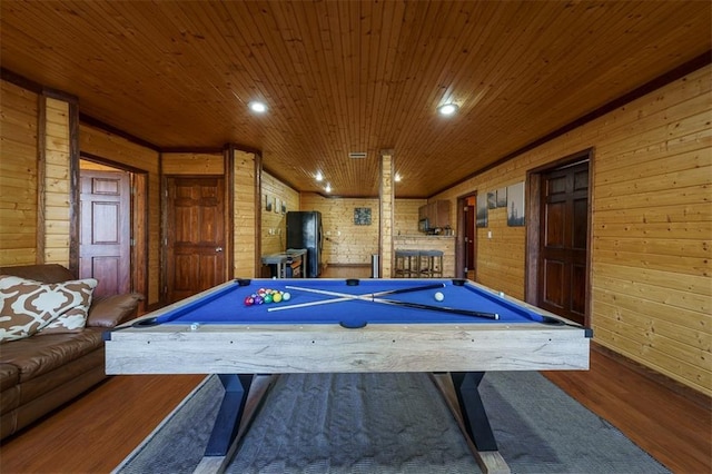 recreation room with hardwood / wood-style flooring, pool table, wooden ceiling, and wooden walls