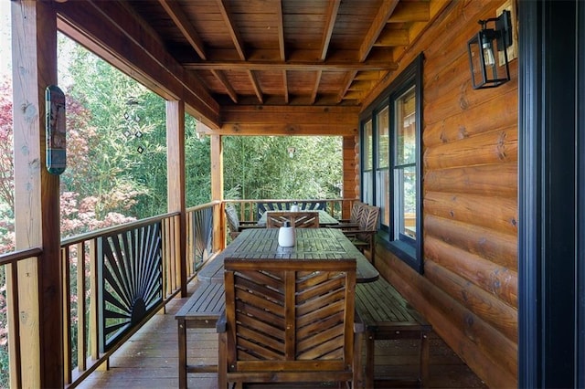 exterior space with beamed ceiling and wooden ceiling