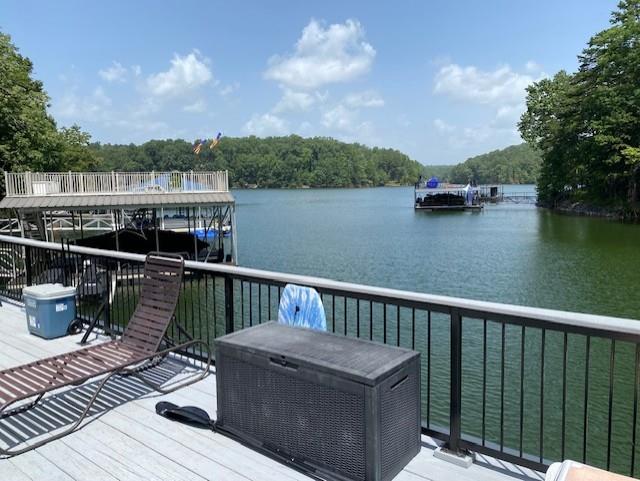 wooden deck featuring a water view