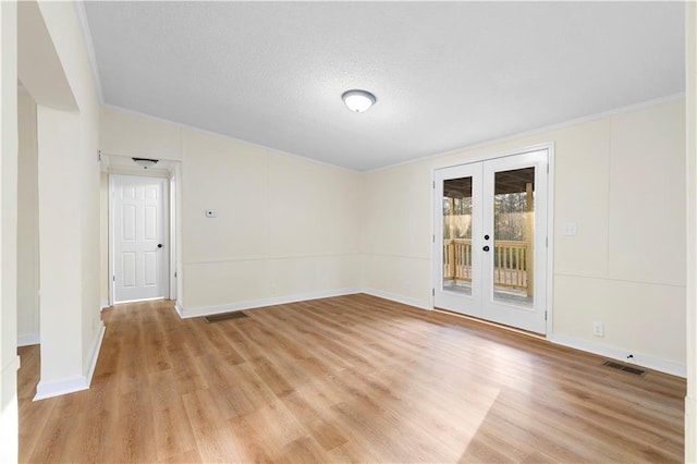 32 Brent Cir SW, Cartersville, GA 30120 - spare room featuring visible vents, french doors, light wood-type flooring, and baseboards