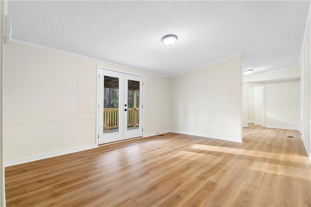 32 Brent Cir SW, Cartersville, GA 30120 - spare room with crown molding, baseboards, light wood-style flooring, french doors, and a textured ceiling