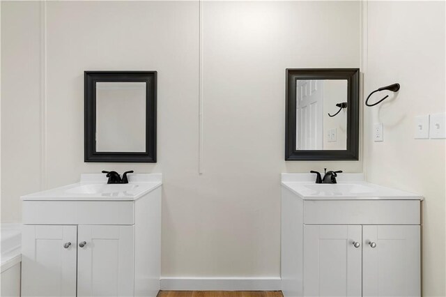 32 Brent Cir SW, Cartersville, GA 30120 - full bathroom featuring a sink, baseboards, and two vanities