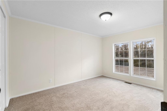 32 Brent Cir SW, Cartersville, GA 30120 - spare room featuring visible vents, carpet floors, a textured ceiling, and crown molding