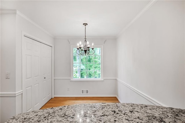 3320 Woodleaf Way, Marietta, GA 30062 - unfurnished dining area featuring light wood finished floors, a chandelier, crown molding, and baseboards
