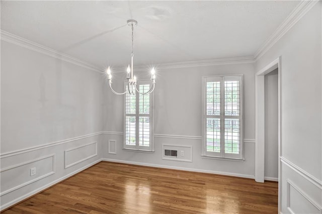 3320 Woodleaf Way, Marietta, GA 30062 - unfurnished dining area with a chandelier, wood finished floors, and ornamental molding