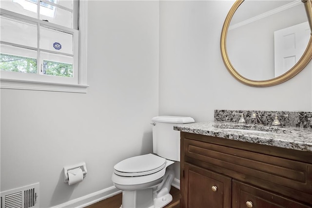 3320 Woodleaf Way, Marietta, GA 30062 - half bathroom featuring healthy amount of natural light, baseboards, toilet, vanity, and crown molding