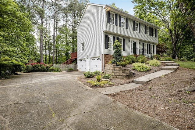 3320 Woodleaf Way, Marietta, GA 30062 - colonial-style house featuring driveway and an attached garage