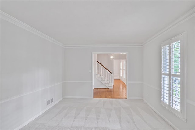 3320 Woodleaf Way, Marietta, GA 30062 - empty room featuring stairway, crown molding, light carpet, a chandelier, and baseboards