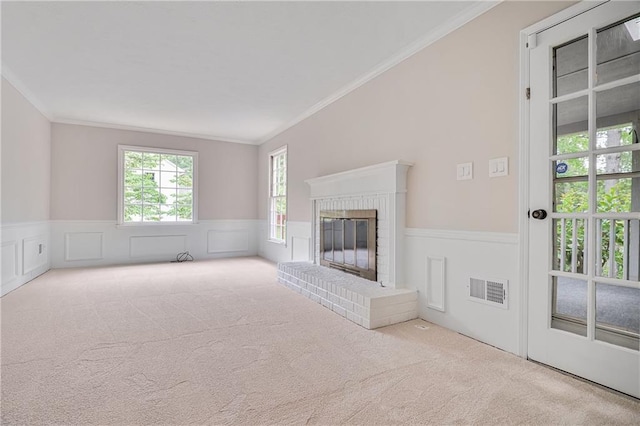 3320 Woodleaf Way, Marietta, GA 30062 - unfurnished living room with carpet flooring, crown molding, wainscoting, and a brick fireplace