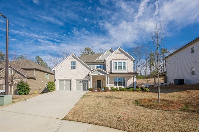 craftsman-style house with central AC unit, a garage, and a front lawn