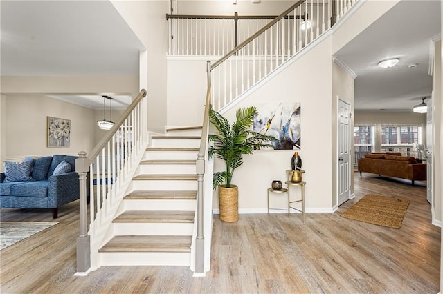 staircase with hardwood / wood-style floors