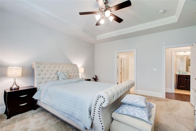 555 Lance View Ln, Lawrenceville, GA 30045 - carpeted bedroom with a tray ceiling, baseboards, ornamental molding, connected bathroom, and a ceiling fan