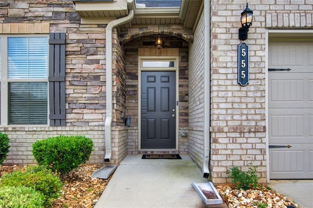555 Lance View Ln, Lawrenceville, GA 30045 - doorway to property featuring brick siding, stone siding, and a garage