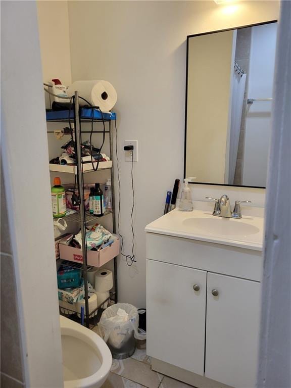 bathroom with a shower with curtain, tile patterned flooring, and vanity