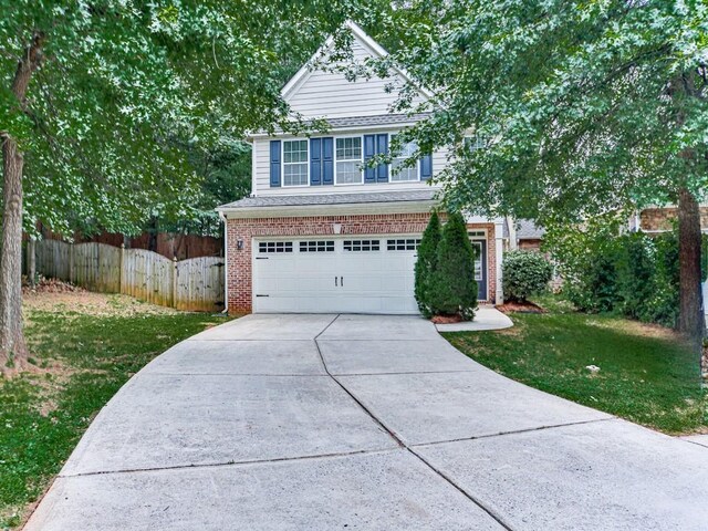 20 Preserve Dr, Newnan, GA 30263 - view of front facade featuring driveway, an attached garage, and brick siding