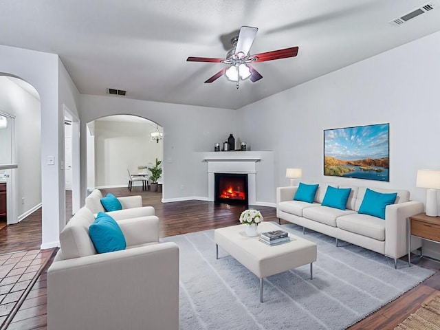 20 Preserve Dr, Newnan, GA 30263 - living area with arched walkways, wood finished floors, and a ceiling fan