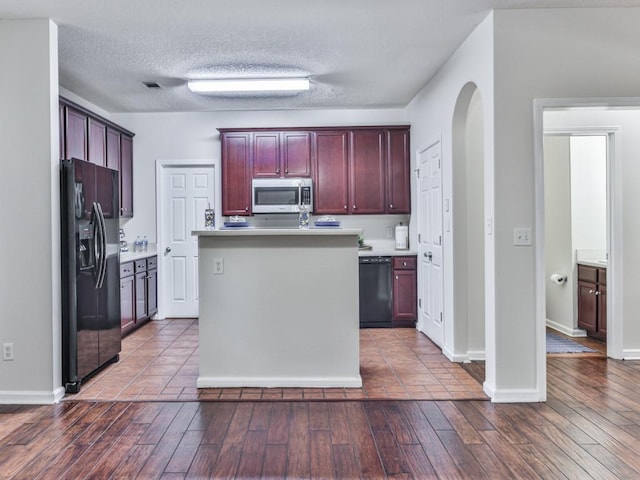 20 Preserve Dr, Newnan, GA 30263 - kitchen featuring black appliances, dark brown cabinets, dark wood finished floors, light countertops, and a textured ceiling