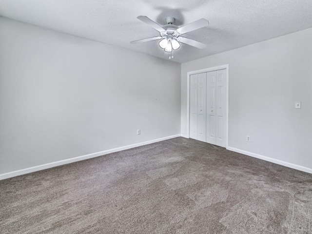 20 Preserve Dr, Newnan, GA 30263 - unfurnished bedroom with a textured ceiling, a closet, dark colored carpet, and ceiling fan