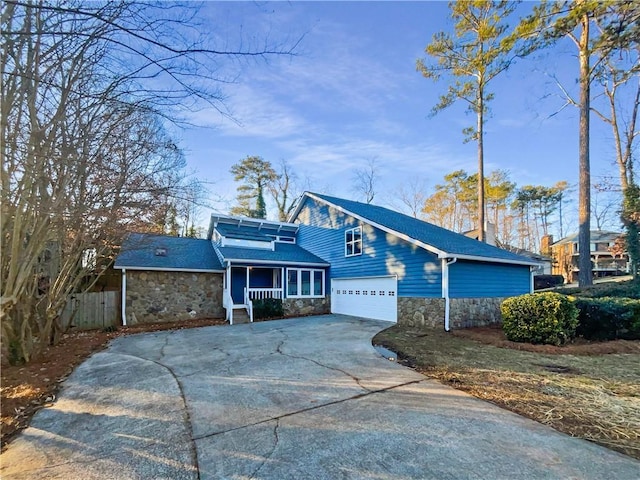 view of front property with covered porch and a garage