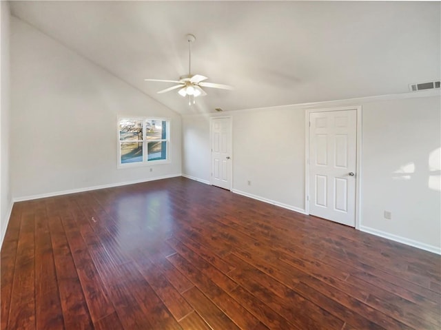 spare room with vaulted ceiling, ceiling fan, and dark hardwood / wood-style flooring