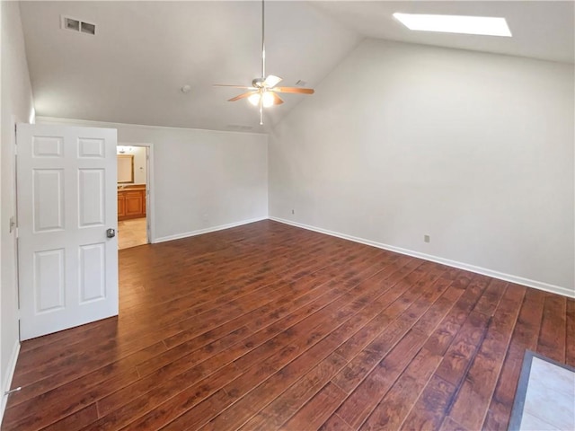 interior space featuring dark hardwood / wood-style floors, ceiling fan, and lofted ceiling with skylight