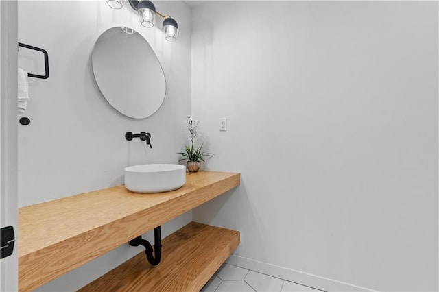 bathroom featuring sink and tile patterned flooring