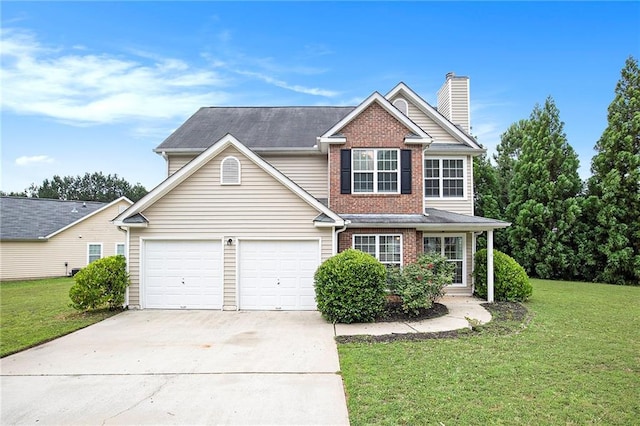 view of front of property with a garage and a front lawn