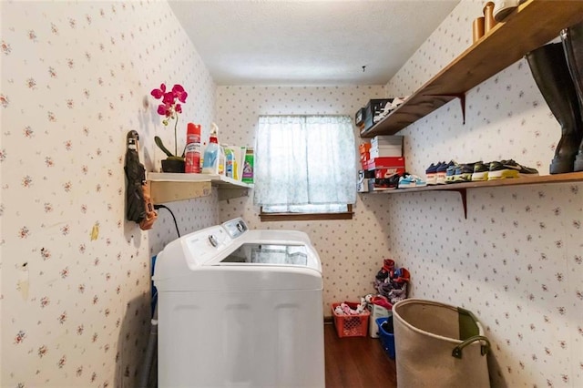 laundry room with laundry area, wood finished floors, washer and dryer, and wallpapered walls