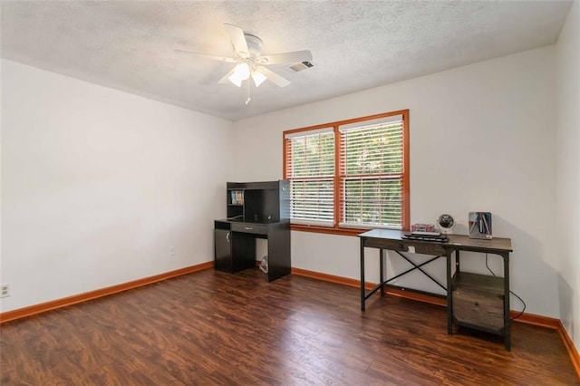 office area with a ceiling fan, a textured ceiling, visible vents, wood finished floors, and baseboards