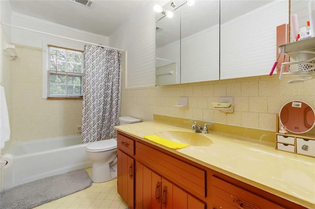 full bathroom featuring tile walls, shower / bathtub combination with curtain, vanity, and toilet
