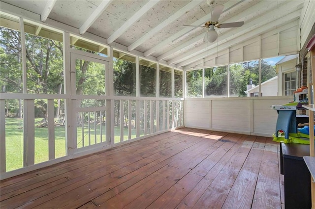 unfurnished sunroom with ceiling fan