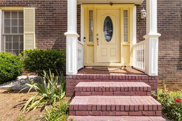 entrance to property with brick siding