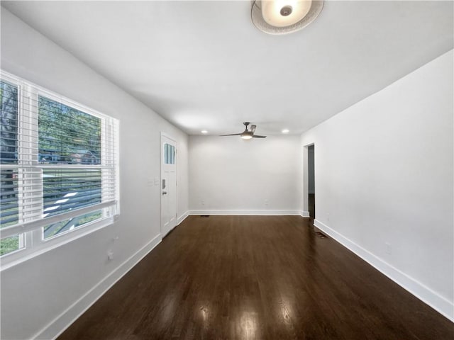 interior space featuring dark hardwood / wood-style floors and ceiling fan