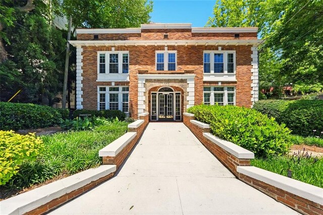 242 12th St NE Unit 1A, Atlanta, GA 30309 - view of front facade with brick siding and french doors