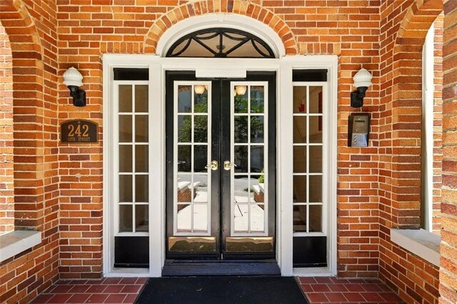 242 12th St NE Unit 1A, Atlanta, GA 30309 - entrance to property with french doors and brick siding