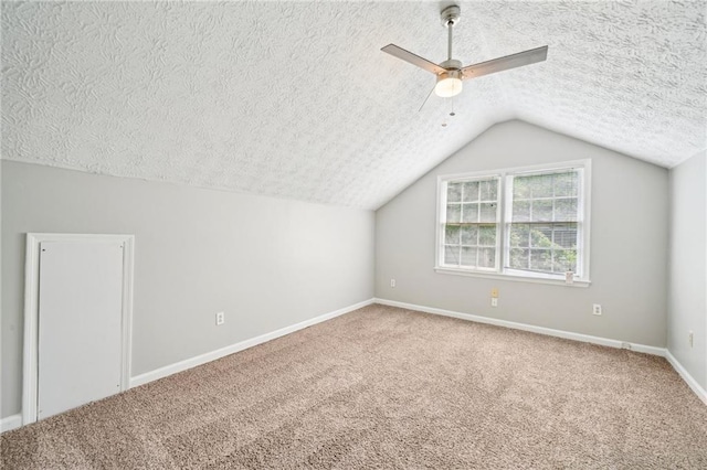 5141 Rocky Run, Stone Mountain, GA 30088 - bonus room featuring a textured ceiling, a ceiling fan, carpet floors, vaulted ceiling, and baseboards